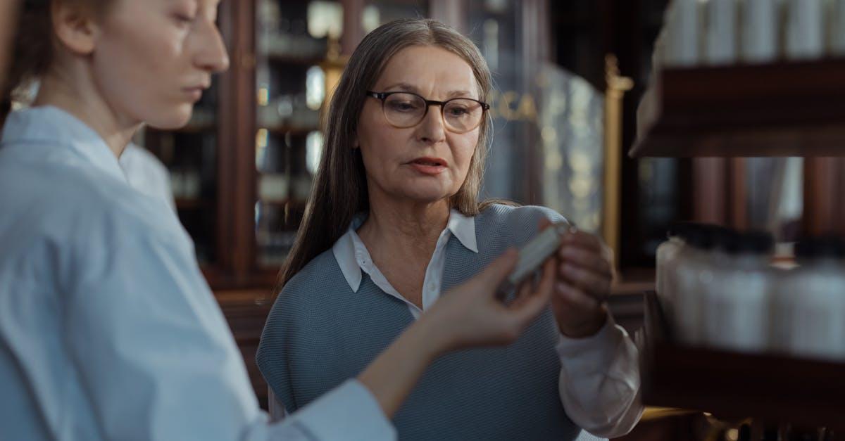 Woman having a friendly conversation with a pharmacist at the counter