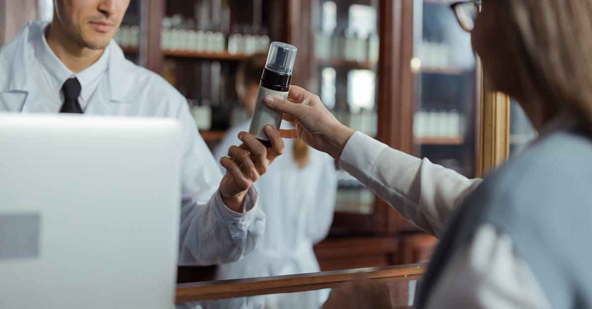 Pharmacist performing a private health check for a patient at Kingfisher Pharmacy in Wakefield